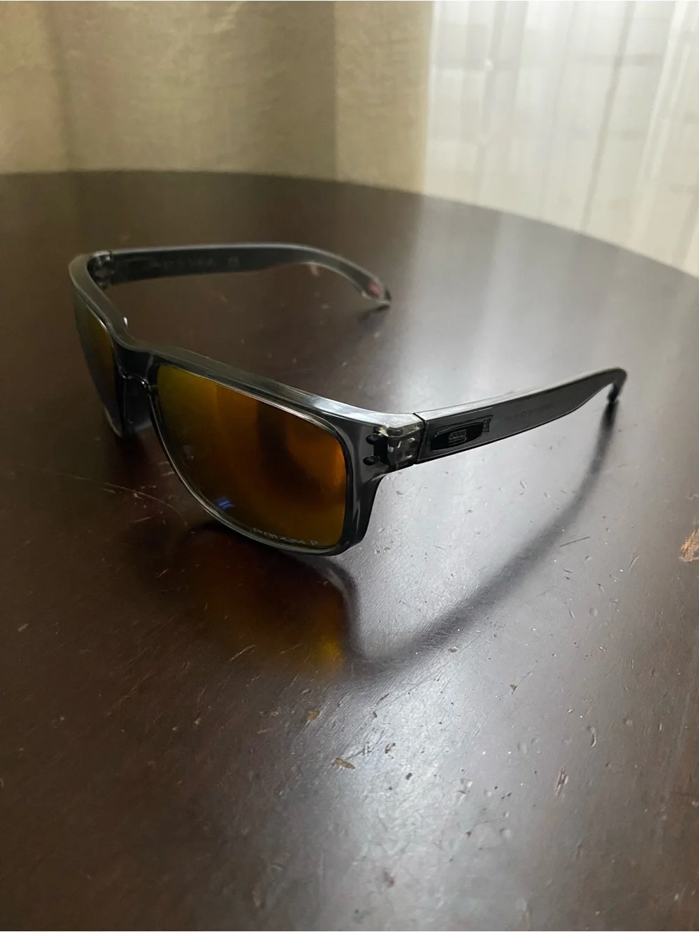 Oakley Smoky Black Frame Sunglasses with Amber Mirror Lenses